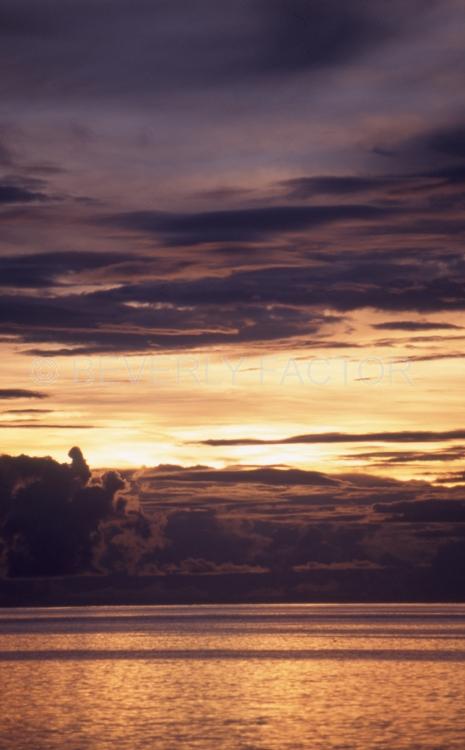 Islands;Sunsets;Sky;clouds;sun;yellow;water;red;sillouettes;colorful;palau micronesia